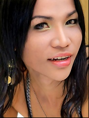 Pretty ladyboy Fai shows off her curves on the bed